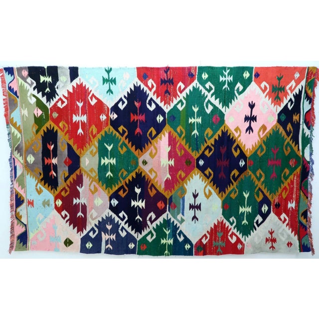 This beauty from westhern of Turkey Barak Nomads weaving. Kilim rug hosts an intriguing pallet of vibrant rich colorways...