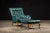 This vintage tufted chair and ottoman set is a deep aqua color and appears to be naugahyde. Ottoman: 13" H x 26" W x 21" L...