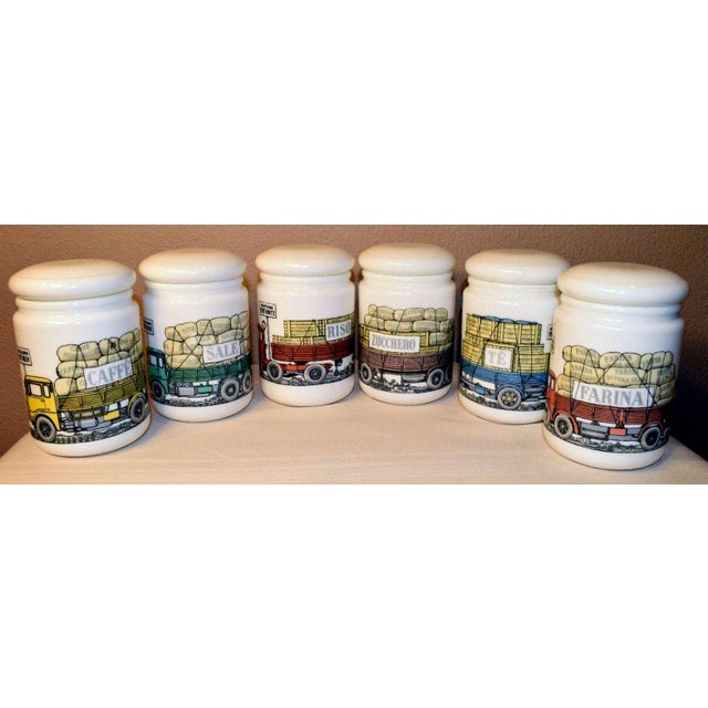 Set of Piero Fornasetti Opaque White Glass Jars and Covers made for Fiat, Six Jars with Lorry or Truck motif, Circa 1960....