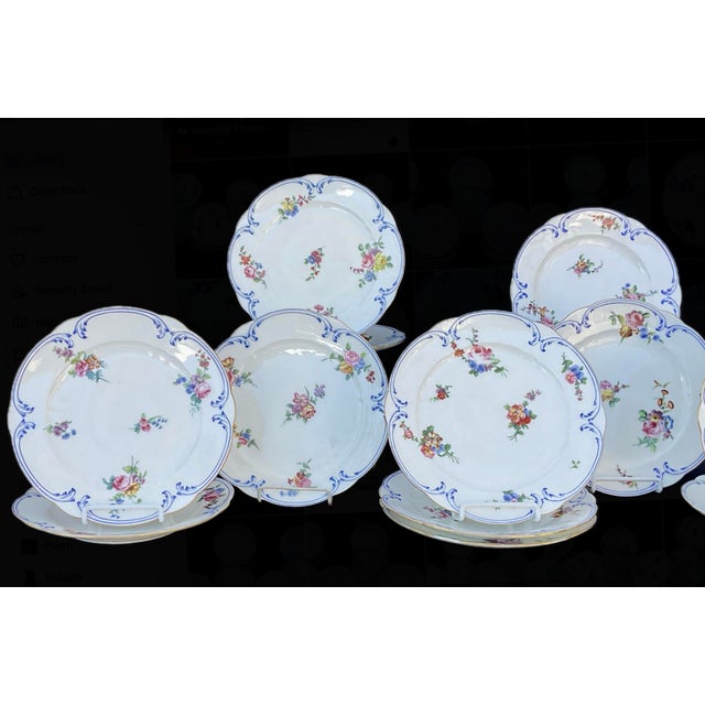 Set of Fourteen Hand-painted Sèvres Porcelain Dinner Plates. The Manufacture de Sèvres, in Sèvres, France, was established...