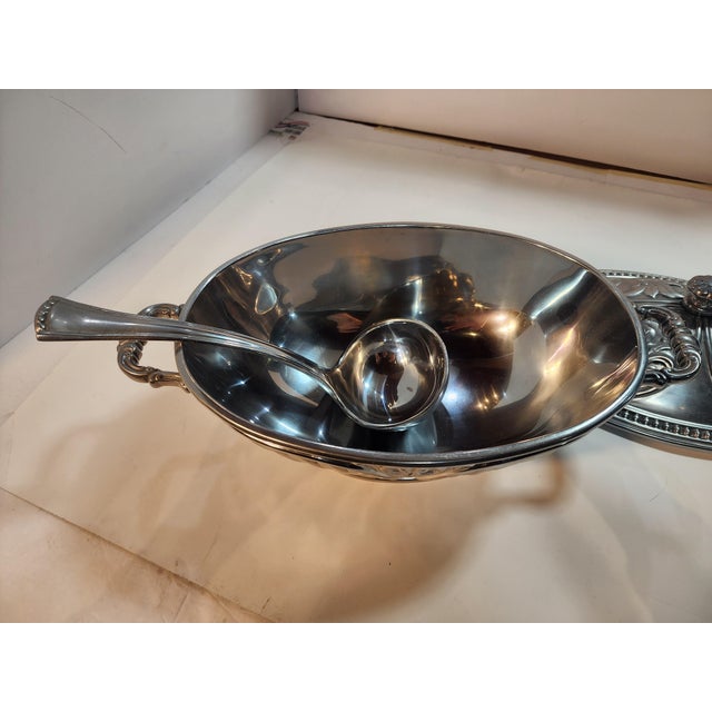 This beautiful soup tureen holds 3 quarts and is in excellent condition. As always, your Home Inspirations purchase...