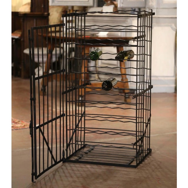 This striking antique wine cage, crafted in Burgundy circa 1880, embodies the practical elegance of traditional French...