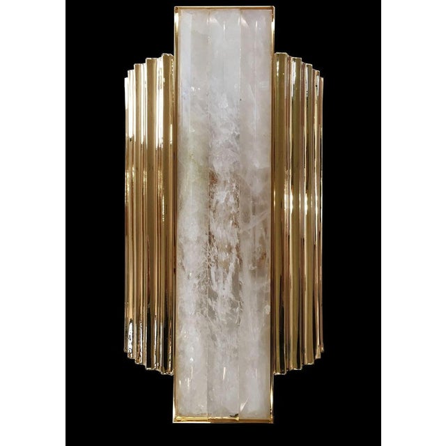 Rock crystal 4 lights wall sconce in gold plate and crystal by aggiolight. Dimensions: w 25 x d 11 x h 45 cm. Materials:...