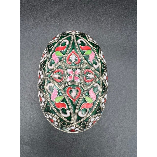 This antique hand fabricated glass enamel cloisonné oval multicolored box is a stunning piece of decorative collectible....