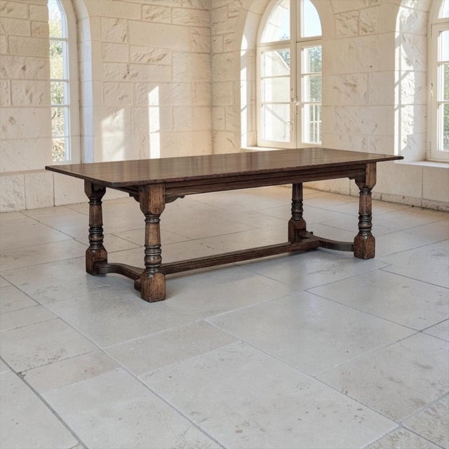 Rooted in the traditions of the English country house, this antique oak dining table was crafted during the 18th century...