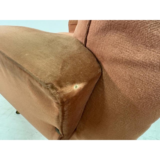 A pair of mid-century Italian armchairs, dating to the 1950s–60s, with a softly sculpted and inviting form. The chairs...