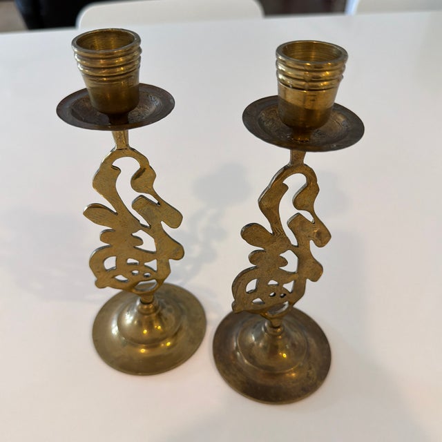These are vintage Asian-style brass candlestick holders featuring the Chinese character for "Good Fortune" or "Luck.