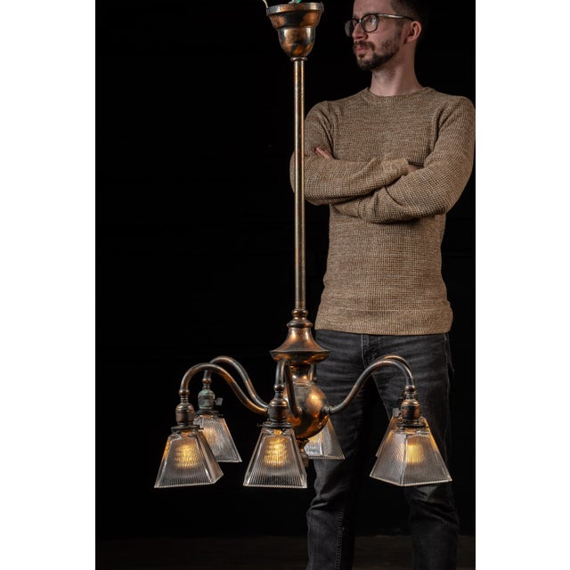 Antique japanned copper ceiling fixture. This piece features an all-japanned copper body that extends downward and...