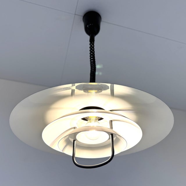 Steel lamp by the Belgian brand Massive. The lamp is designed in the style of Danish Poulsen lamps. Using the coiled cord,...