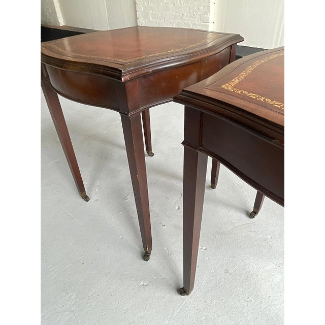 English Regency tea tables, solid mahogany with leather inlay top and c. Table stands on square tapered legs with antique...