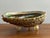 Natural, iridescent abalone shell that was made into a trinket dish. Three acrylic feet level the shell, making it a...