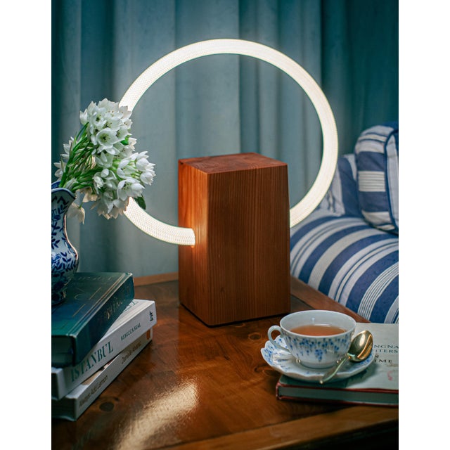 Tavi Lamp The Tavi Lamp is a dimmable minimalist lamp with a redwood base and a rope LED light filament. Product Details:...