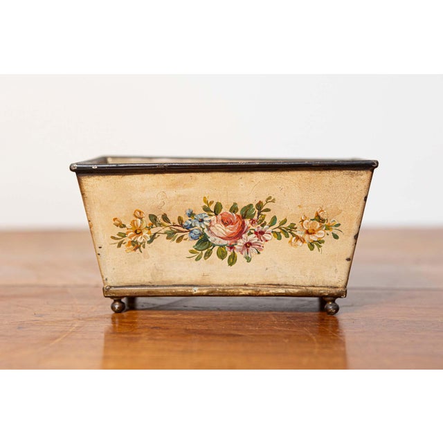 This small 19th-century French planter is beautifully crafted from painted sheet metal, featuring delicate hand-painted...