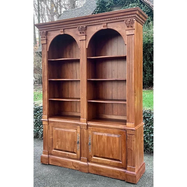 Classic double arch bookcase crafted in solid maple in the USA by Ethan Allen from their popular Legacy Collection. The...