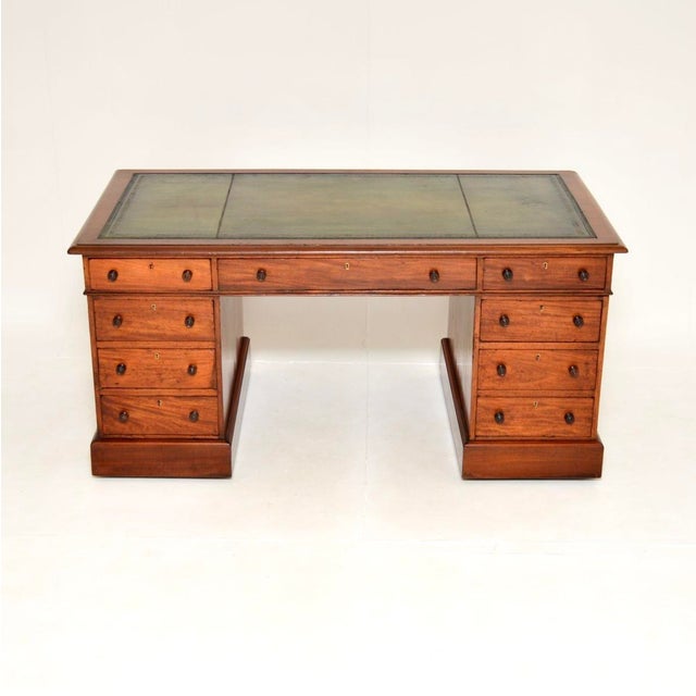 A very smart and well made antique Victorian Walnut leather top pedestal desk. This was made in England, it dates from...