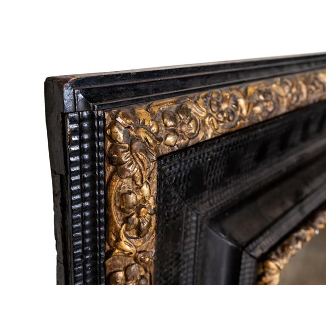 Rectangular black and gold mirror. Hand carved with acanthus details.
