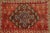 This gift-size 2x3 vintage Turkish rug, circa 1950–1959, features a striking geometric medallion framed by stepped borders...