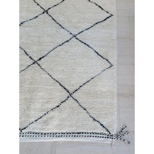 Berber rug in handmade wool with contrasting graphic design, Morocco production of the 2000s