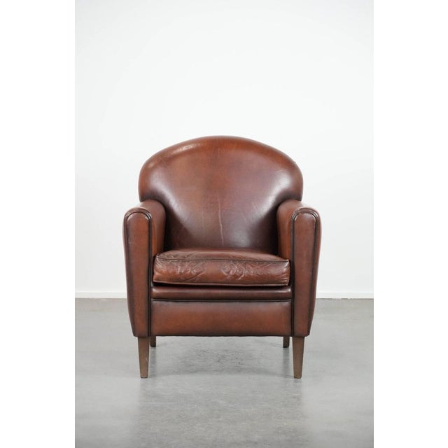 This beautifully shaped armchair is crafted from sheepskin and, thanks to its timeless design, fits into virtually any...
