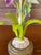 A wonderfully whimsical vintage metal tole table lamp featuring a sculptural arrangement of hand-painted flowers and...
