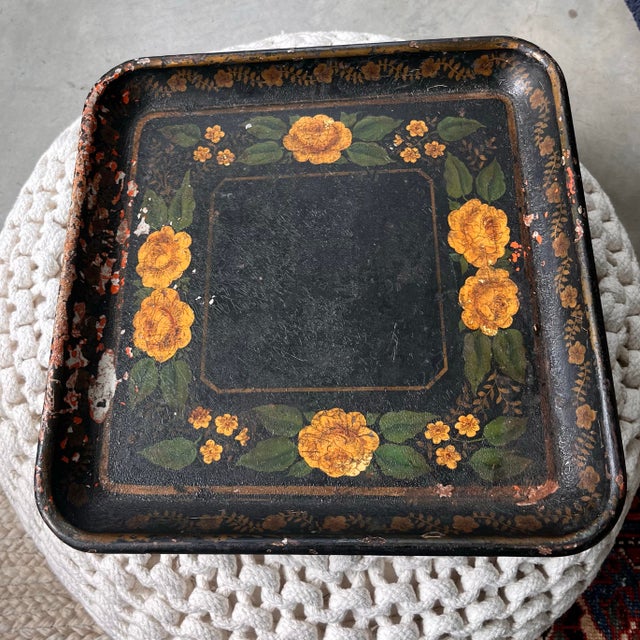 An antique, hand-painted, toleware tray. Yellow roses framed by a boarder of golden vines and petite blooms.