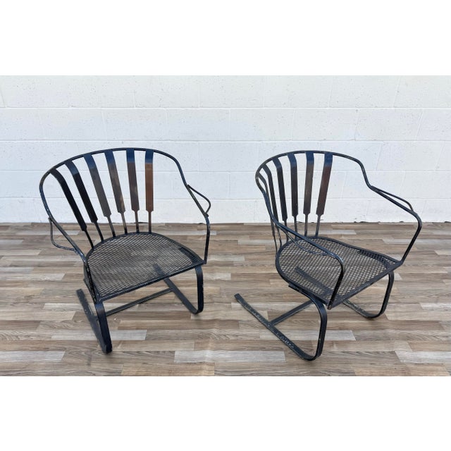 Add timeless mid-century style to your patio, garden, or sunroom with this pair of vintage wrought iron patio bouncer...
