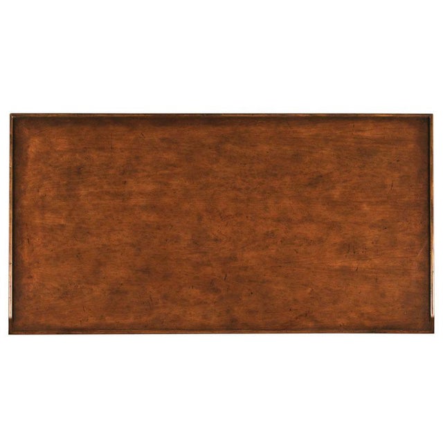 Designed in the spirit of 19th Century French originals, a galleried, rectangular cherry top rests over two storage...