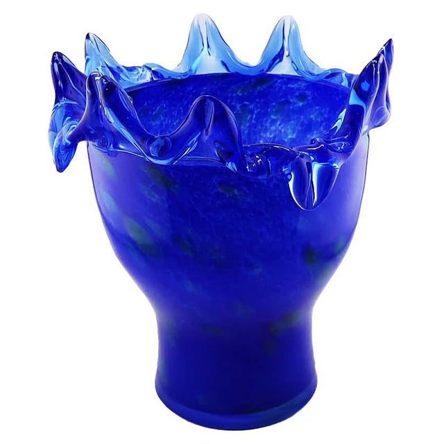 This striking mid-century modern piece features a rich, deep cobalt blue coloration with a mottled/spattered green texture...
