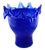 This striking mid-century modern piece features a rich, deep cobalt blue coloration with a mottled/spattered green texture...