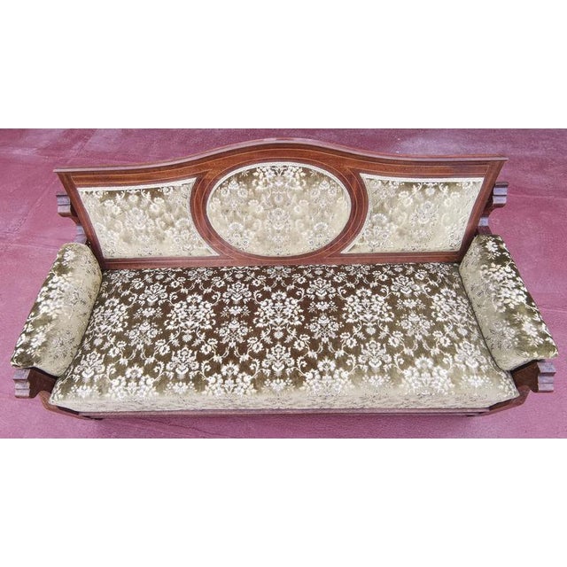 Elegant sofa in green and cream damask fabric with a mahogany veneer frame complete with mechanisms to convert it into a...