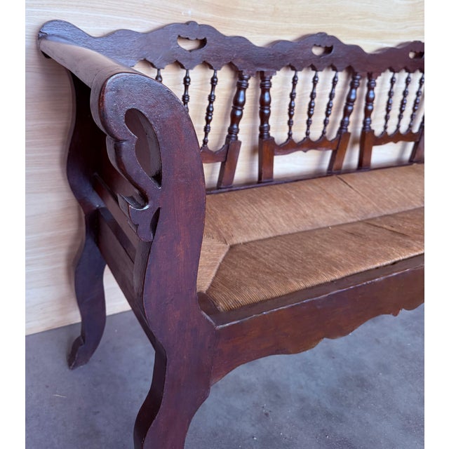 Rare midcentury sofa, settee or bench in the Spanish style with cane back. Shown in original condition, please note price...