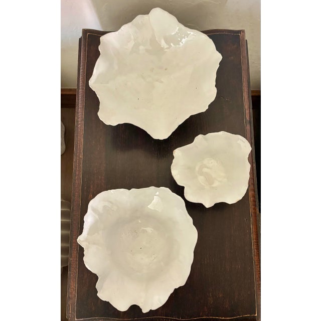 Bring organic elegance and sculptural beauty to your home with this stunning set of three Fleur ceramic decorative bowls...