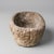 An extremely rare crucible, likely used for foundry work or alchemical purposes, carved from a single block of volcanic...