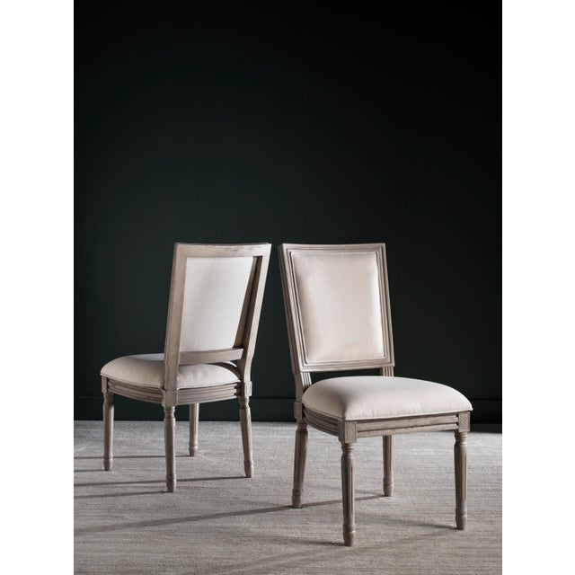 Old world elegance meets modern-day comfort in this set of two French side chairs with artfully carved frames finished in...