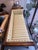 This is a late 19th century antique sofa. It has a mahogany wood frame. It has distinct flared arms. It has hand painted...
