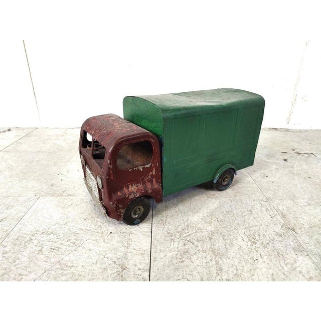 Vintage toy car from the english brand 'Tri-ang'. The charm is in the wear and tear of this item, it makes this little...