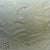1980's hand-crafted celadon porcelain moon jar with lid. Incised surface decoration features stylized pomegranates. Pale...