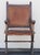 Skilled joinery is on full display in this gothic arts and crafts style chair, crafted in solid wood with a leather seat...