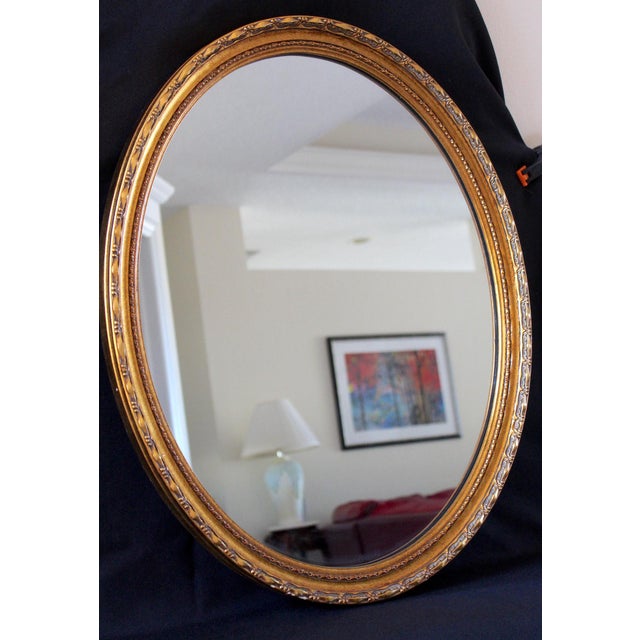 Elevate your interior with this elegant vintage LaBarge oval wall mirror, a timeless decorative piece known for its...