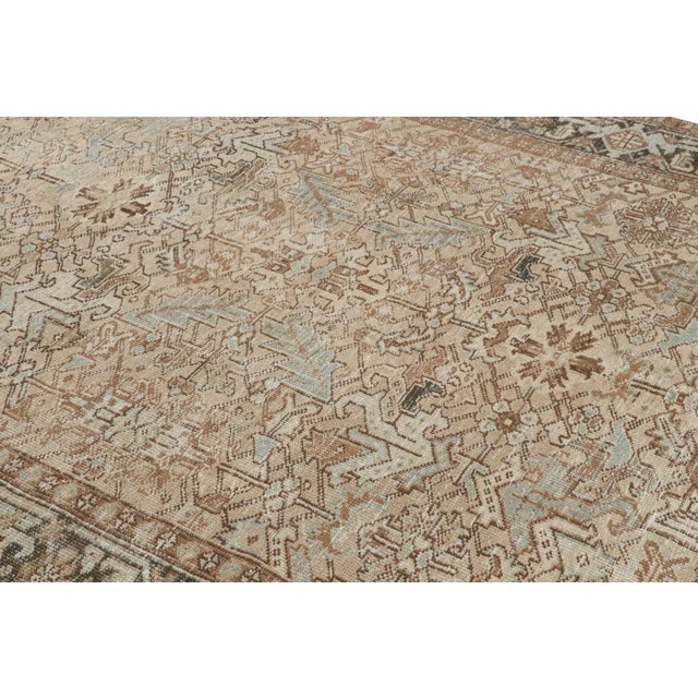 Hand-knotted in wool, this vintage 7x9 Turkish rug is inspired by Persian Heriz rugs that enjoy this dense, almost tribal...