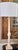 Presenting a classically formed vintage Restoration Hardware style natural stone column table lamp in warm colors of...