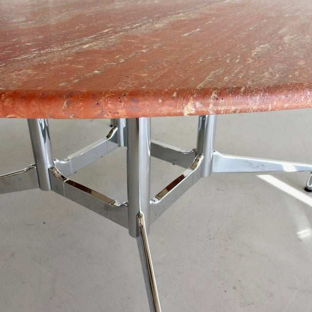 Full chrome-plated 'Segmented Table' base by Ray and Charles Eames (64100 series) with a round stone top made of matt...