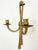 A vintage brass double wall candle sconce in neoclassical style, likely mid-20th century. the piece presents a balanced...