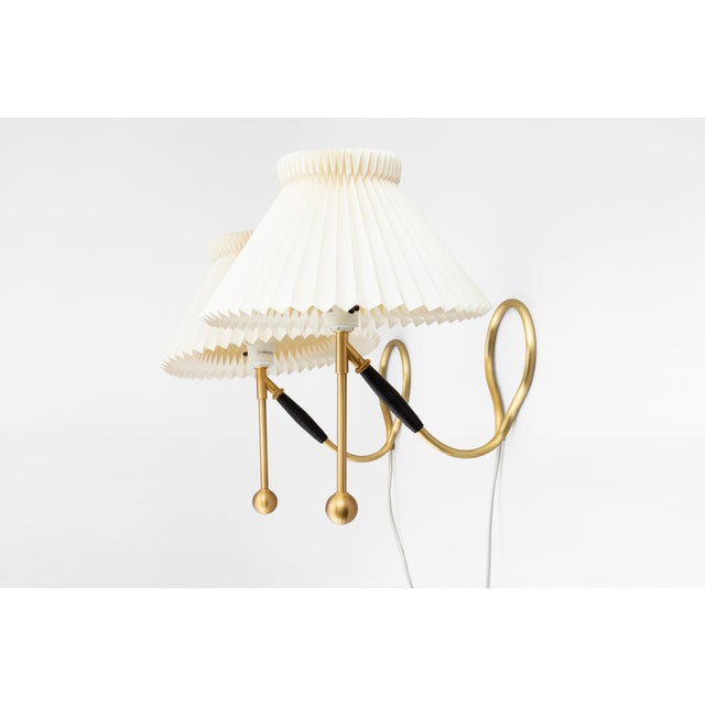 Set of two vintage le klint model 306 table lamps designed by kaare klint, denmark, 1950s. Featuring elegant brass bases...