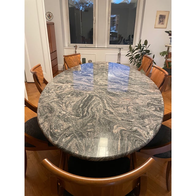 Custom-designed and built 30 years ago, this one-of-a-kind solid granite dining table is a true statement piece — nothing...