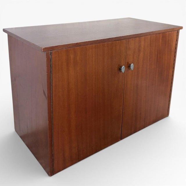 This danish teak record cabinet offers a stylish and practical solution for vinyl enthusiasts seeking a mid century...