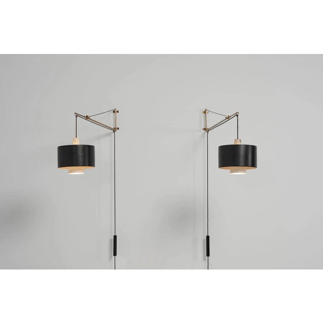 Exceptional Model 2061 wall lamp designed by Gaetano Sciolari and produced by Stilnovo in Italy in 1954. This is the rare...