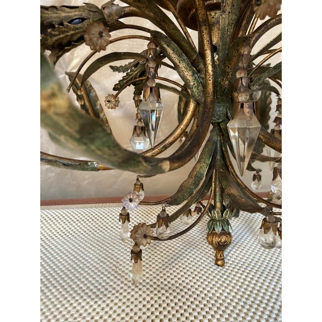 Very original chandelier that hugs the ceiling. It houses 6 bulbs and the glass chiseled pendants together with floral...