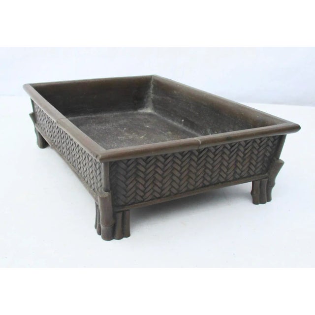 Low bronze footed tray with bamboo modeled feet and basketweave side surfaces and the underside surface also. Signature...