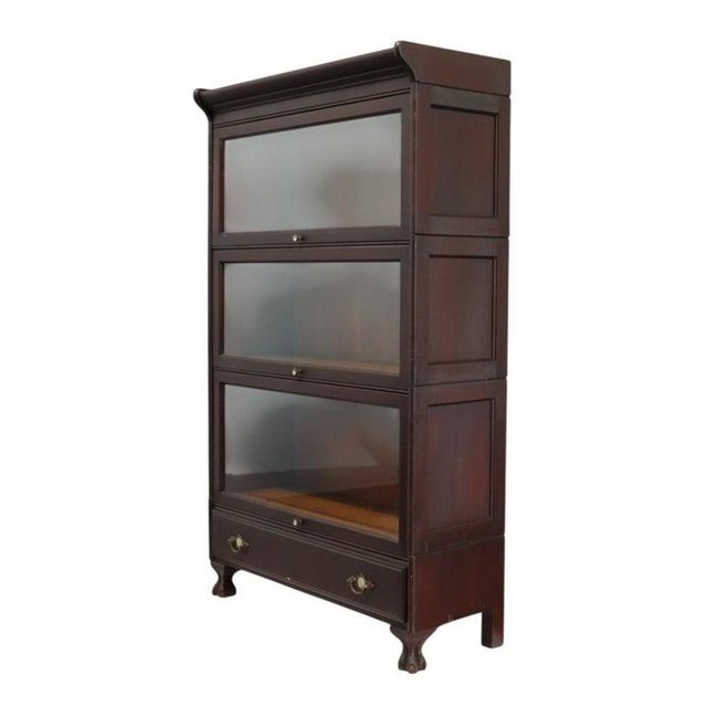 An antique Arts & Crafts mahogany barrister bookcase, originating from Grand Rapids and dating to approximately 1920. This...